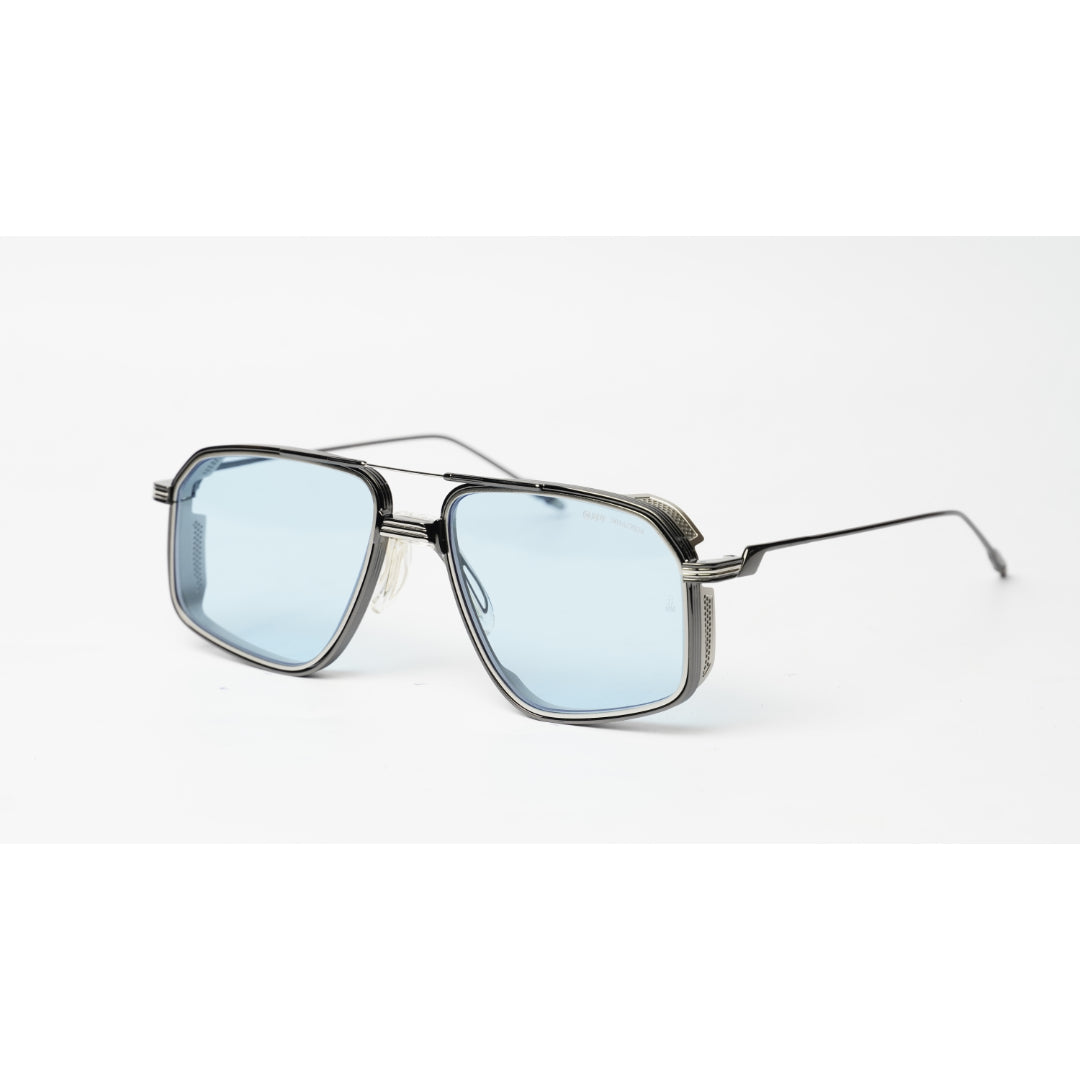 A pair of angular aviator-style sunglasses with a dark gray metal frame and light blue tinted lenses, shown on a clean white background.